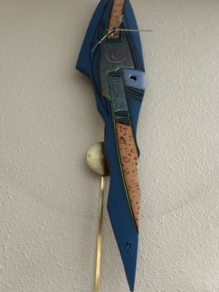 Reloj de pared con péndulo