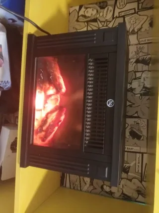 Estufa chimenea negra con cristal