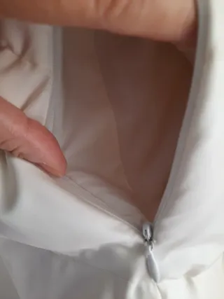 Piumino lungo beige con cappuccio