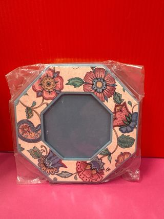 Álbum de fotos y marco floral