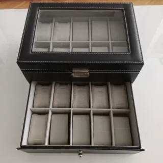Relojero negro con cajón y tapa