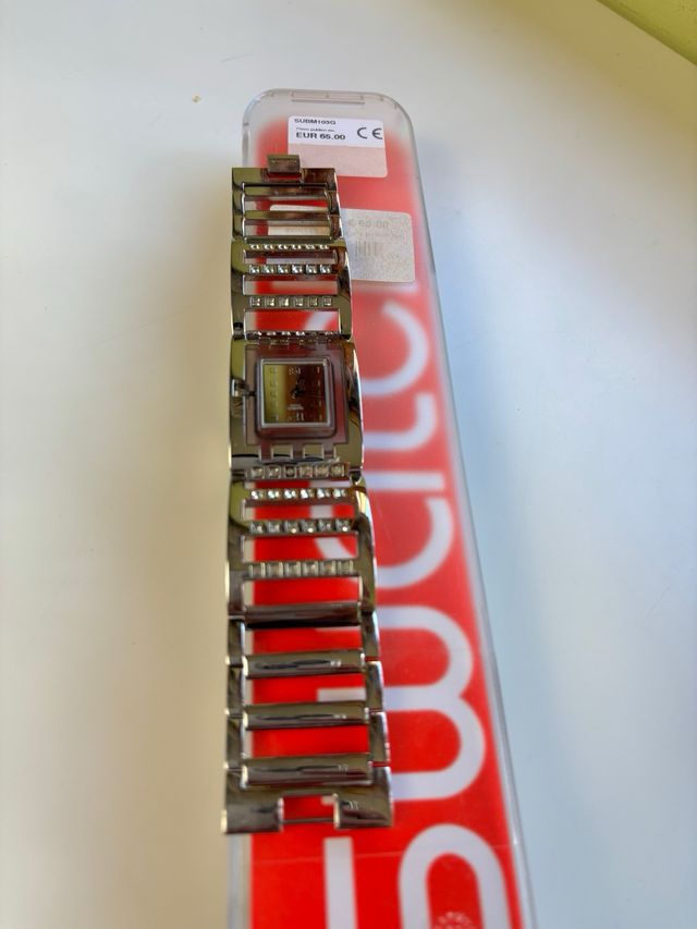 Reloj Swatch SUBM103G metálico con caja original
