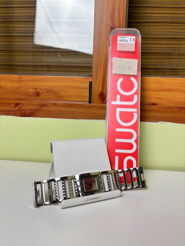 Reloj Swatch SUBM103G metálico con caja original