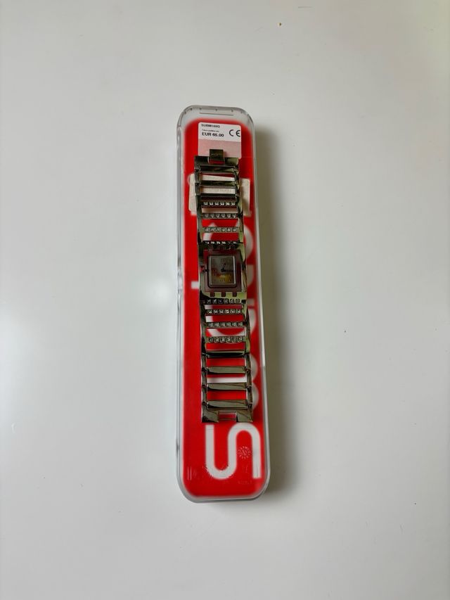 Reloj Swatch SUBM103G metálico con caja original
