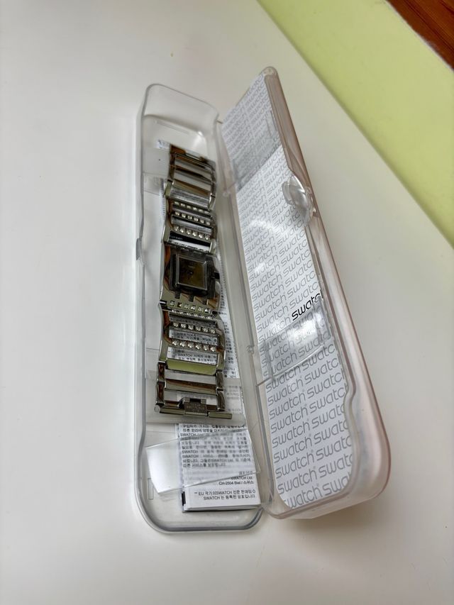 Reloj Swatch SUBM103G metálico con caja original