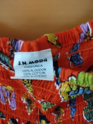 Pantalón gomillas. naranja estampado mariposas