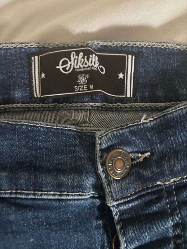 Vaqueros SikSilk desgastados