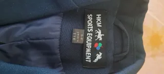 Chaqueta de equitación azul marino para concurso.