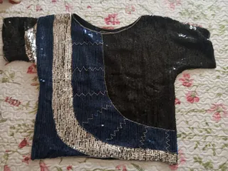 Blusa lentejuelas negra y plateada