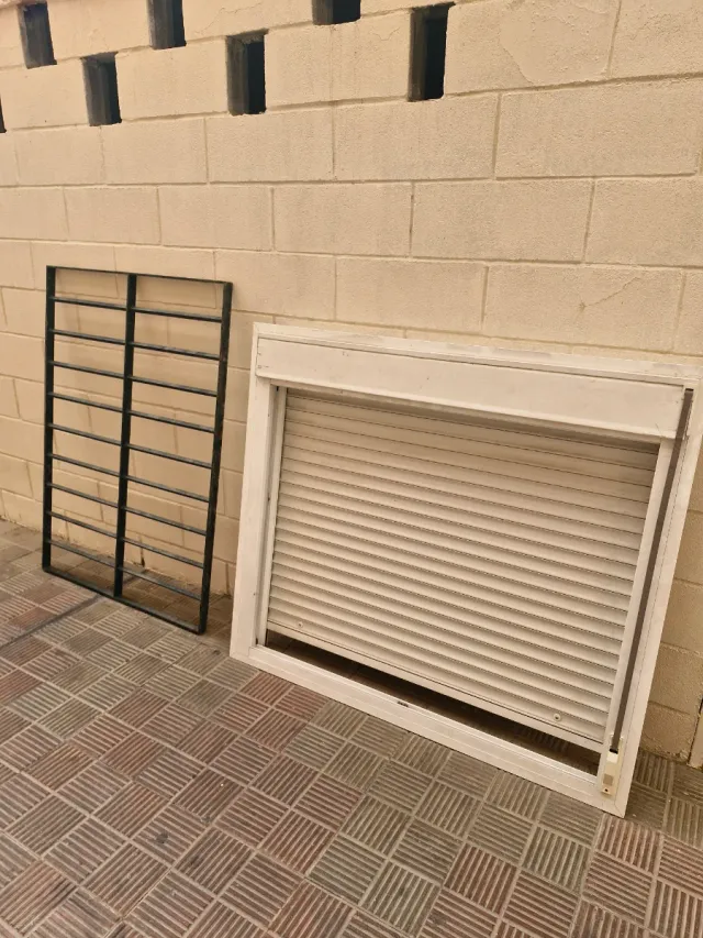Ventana aluminio y rejas hierro