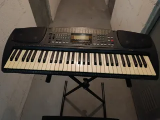 Teclado eléctrico con soporte y banqueta