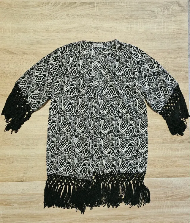 Vestaglia elegante con frange