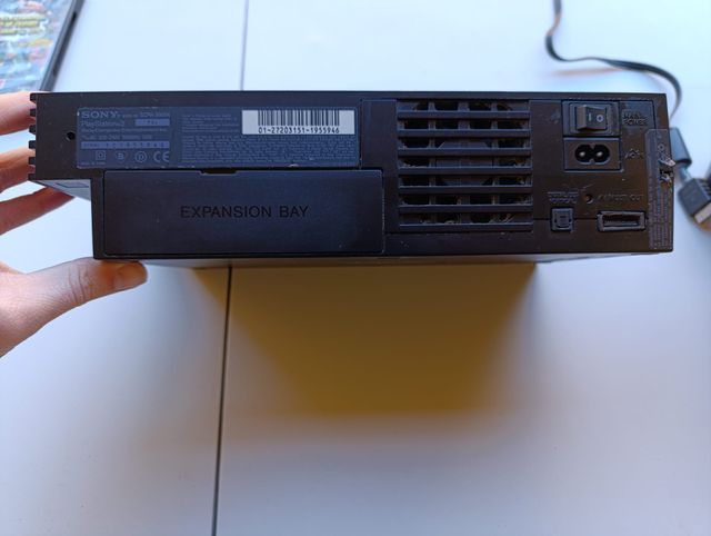 Consola PS2 + Juego Smack Down VS Raw 2008