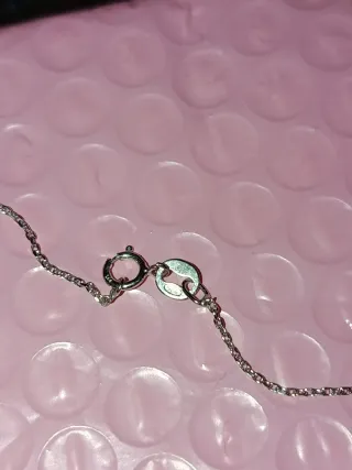 Cadena plata con cruz, aro y corazón