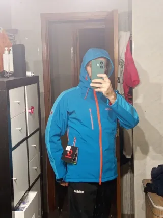 Chaqueta Mammut azul y naranja