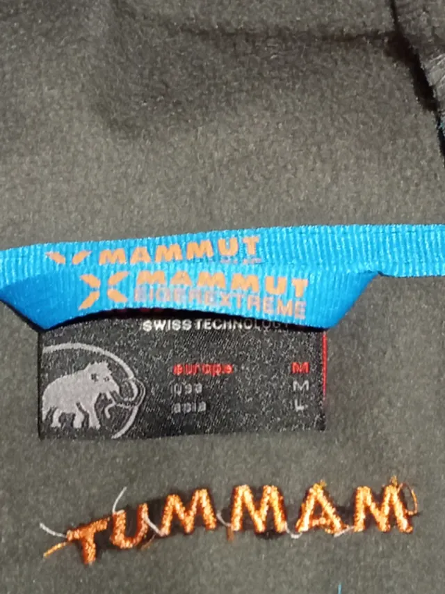 Chaqueta Mammut azul y naranja