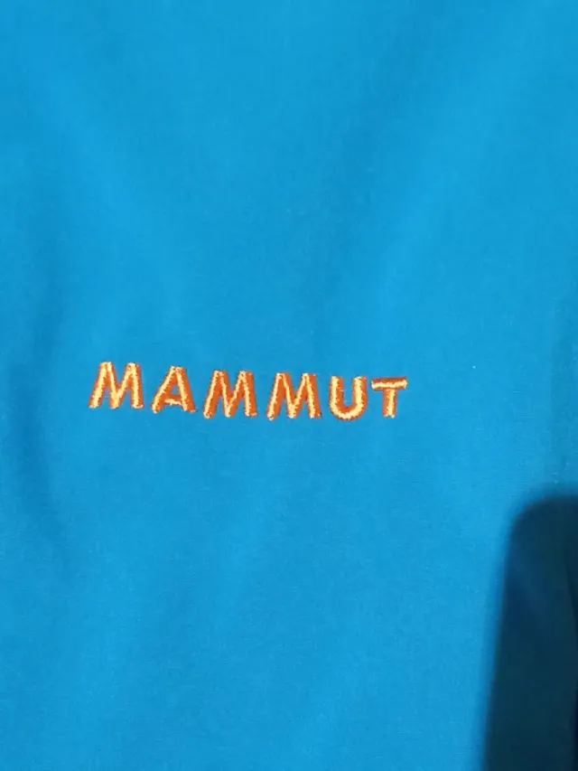 Chaqueta Mammut azul y naranja