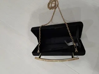 Bolso de fiesta negro y dorado
