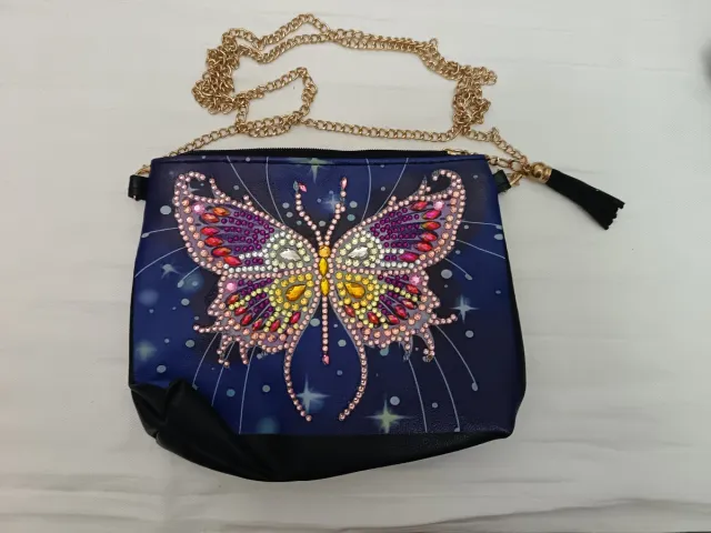 Bolso mariposa con pedrería