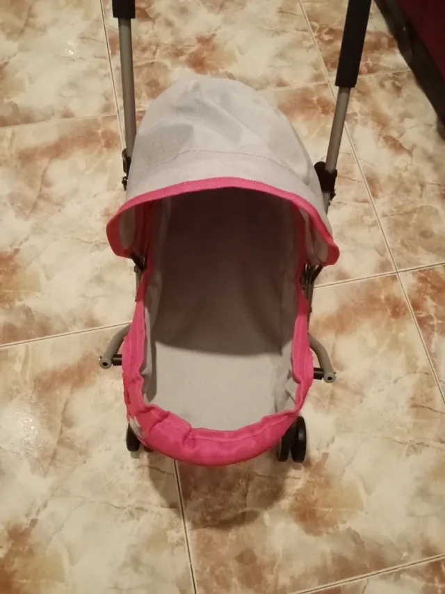 Silla de paseo para muñeco rosa