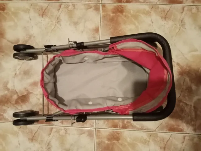 Silla de paseo para muñeco rosa