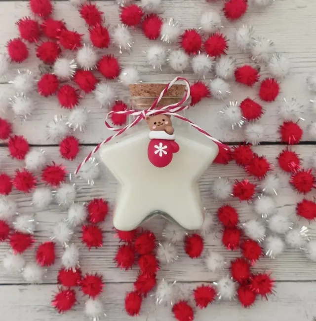 Candela a forma di stella profumata all'arancia