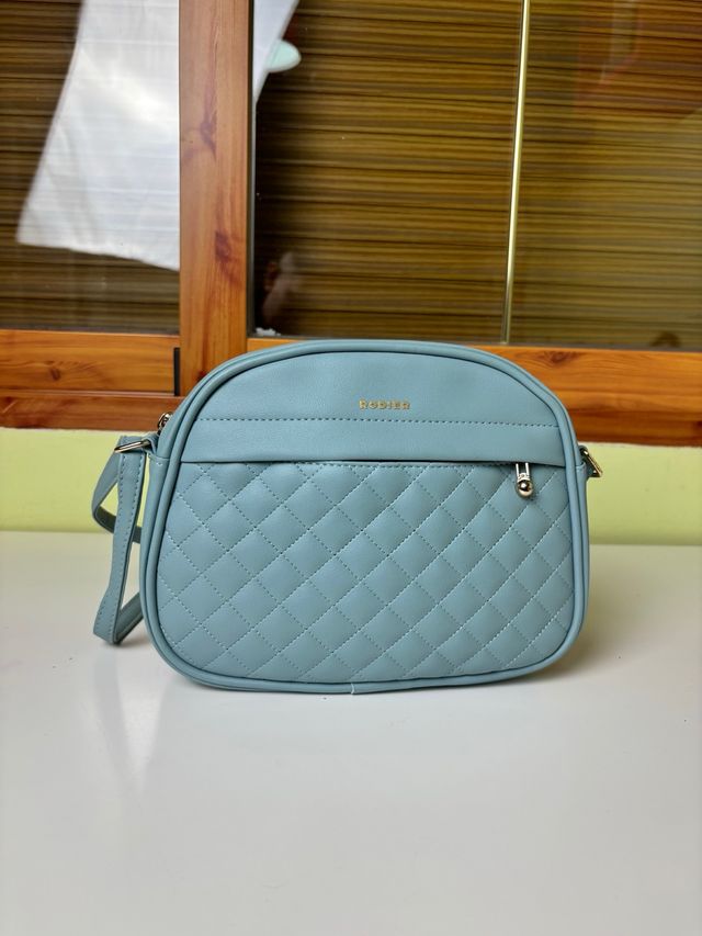 Bolso bandolera Rodier azul celeste acolchado