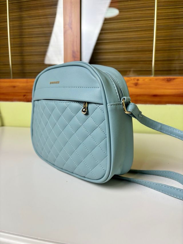 Bolso bandolera Rodier azul celeste acolchado