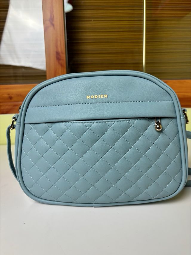 Bolso bandolera Rodier azul celeste acolchado