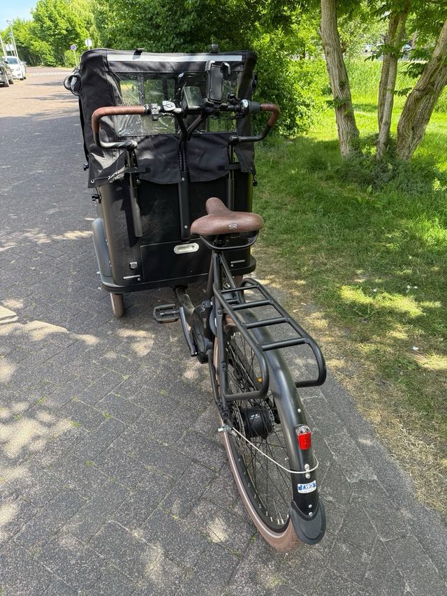 Bicicleta cargo eléctrica para llevar 4 niños