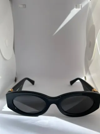 Occhiali da sole Miu Miu neri e oro
