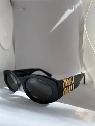 Occhiali da sole Miu Miu neri e oro