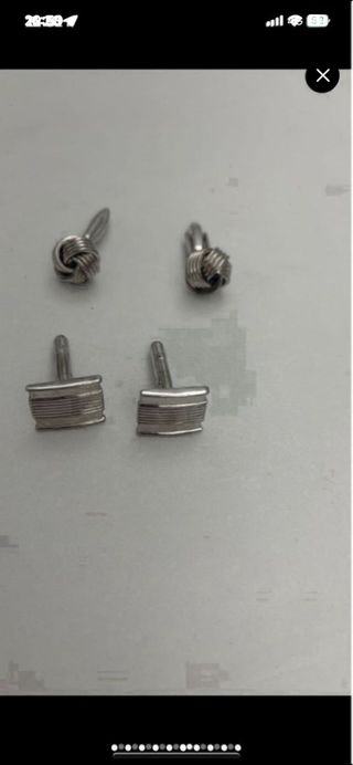 22 pares de gemelos: plata y negro y dorados