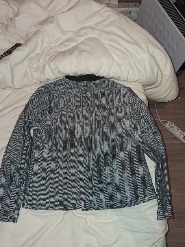 Chaqueta espiga cuello redondo