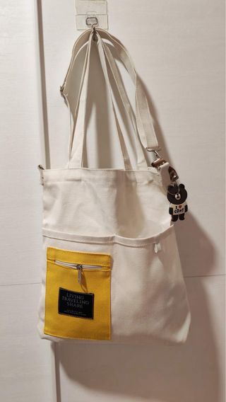 Bolso de lona blanco y amarillo