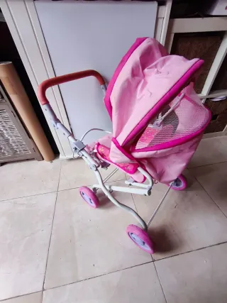 Sillita de paseo para muñecos rosa