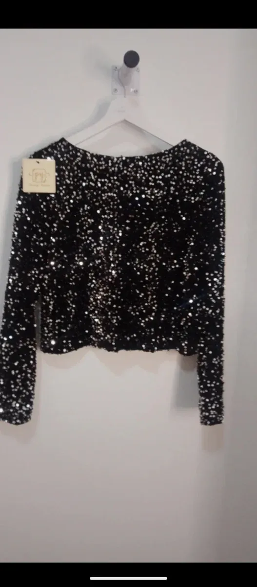 Chaqueta lentejuelas negra y plateada