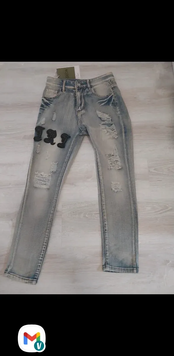 Jeans denim strappati uomo