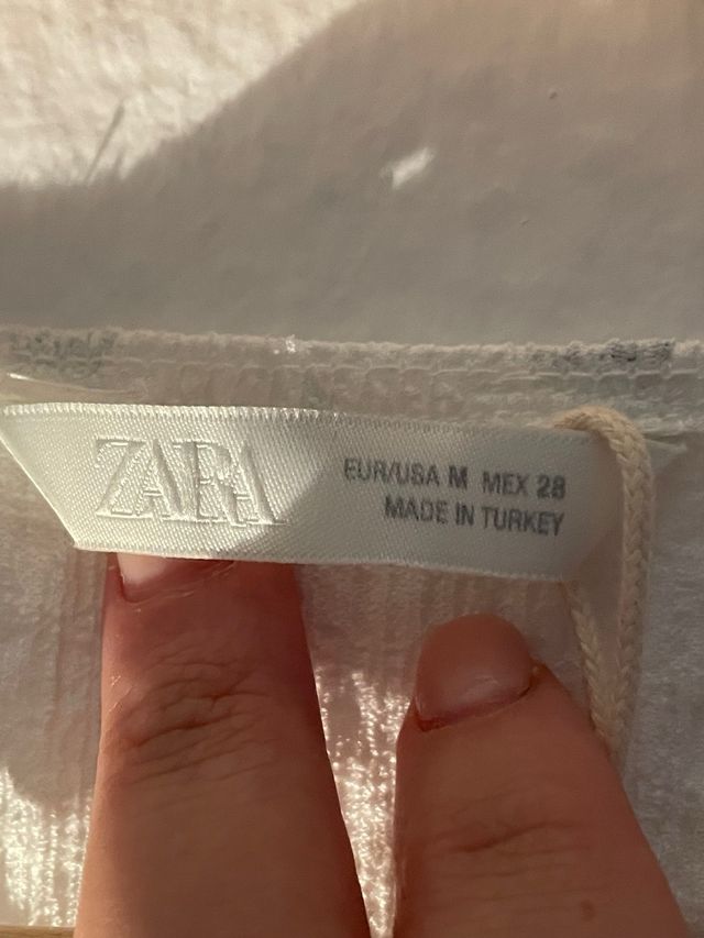 Top Zara blanco con lazo negro Talla M