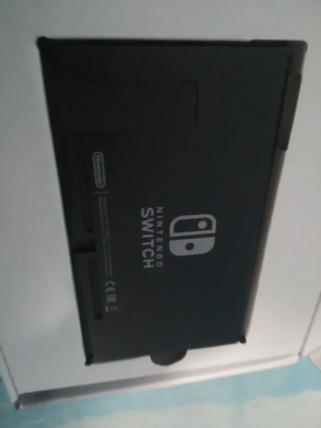 Nintendo Switch Gris y Negro con sus embalajes