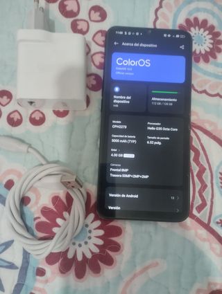 Móvil con cargador y cable USB