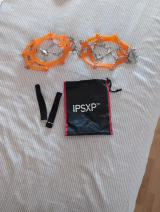 Crampones ligeros naranjas con bolsa