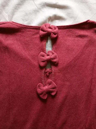 Maglioncino misto lana color corallo con fiocchi