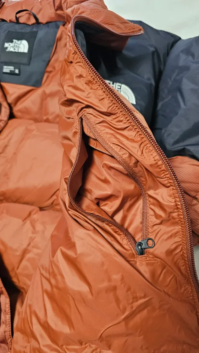 The North Face Plumas Naranja y Negro