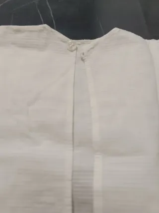 Camicetta neonata bianca in cotone con pizzo