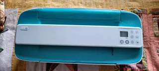 Impresora HP color verde y blanco