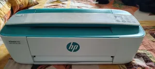 Impresora HP color verde y blanco