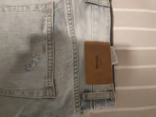 Bermuda vaquera hombre desgastada