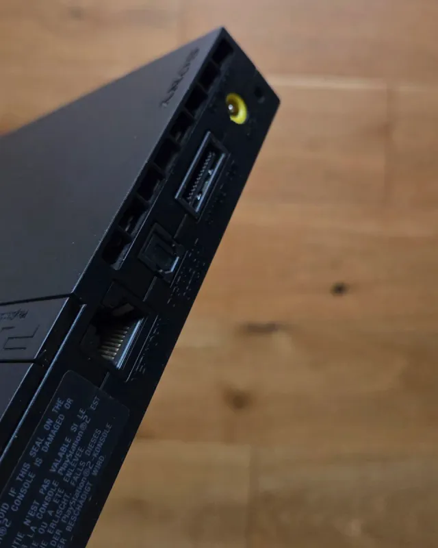 PlayStation 2 Slim + Multitap, controller, giochi