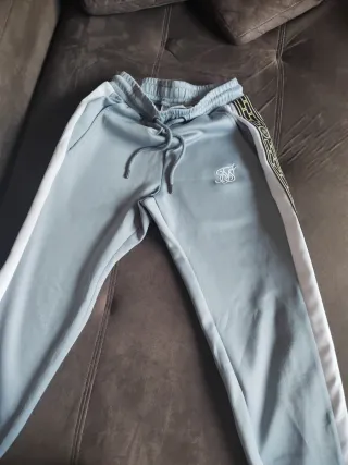 Pantalón SikSilk azul y blanco